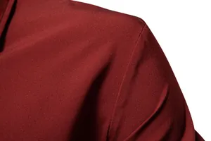 Close-up of burgundy men's casual shirt showing smooth fabric texture and shoulder stitching