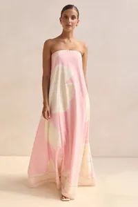 Full-length view of a pink floral strapless maxi dress with elegant A-line silhouette