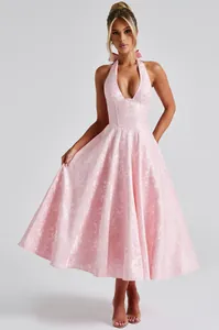 Elegant light pink jacquard halter neck midi dress with plunging V-neck and flared skirt
