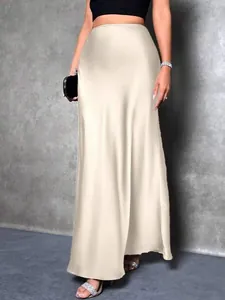 Elegant champagne satin maxi skirt with high waist featuring a silky finish for women