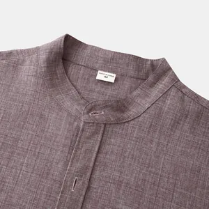 Close-up detail of mandarin collar on purple linen shirt showing the size M tag