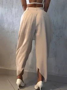 Back view of high-waisted beige flower bud trousers with pleated design and cropped cut