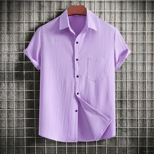 Close-up of lilac casual short-sleeve shirt with chest pocket and crinkle texture