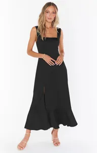 Elegant black square-neck sleeveless maxi dress featuring a high side slit and ruffled hem