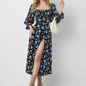 Macro view of a French floral maxi dress featuring a square neck and high slit detail.