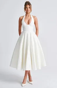 Elegant white halter V-neck jacquard midi dress featuring a voluminous flared skirt