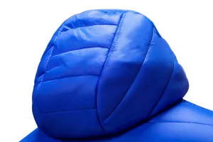 Detailed close-up of a royal blue lightweight hooded puffer jacket's hood stitching.