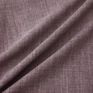 Close-up of deep burgundy textured cotton linen fabric showing cross-hatch weave and soft folds