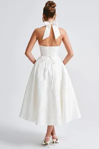 Detailed back view of white halter jacquard dress with bow and corset lace-up