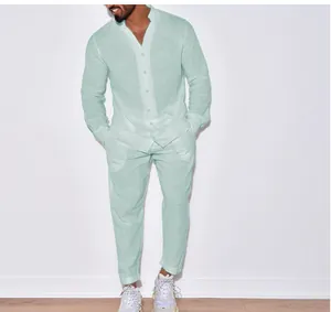 Full body shot of a man wearing a stylish mint green linen shirt and pants casual set.