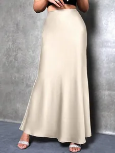 Detail view of elegant champagne satin maxi skirt with silky finish and smooth drape