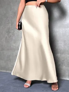 Elegant champagne satin maxi skirt with luxurious sheen and graceful flowing drape detail