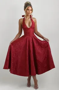 Full length view of the elegant dark red jacquard halter dress with a deep V-neckline.