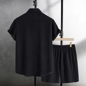 Detail of men's black jacquard short sleeve shirt and shorts set on a clothing rack