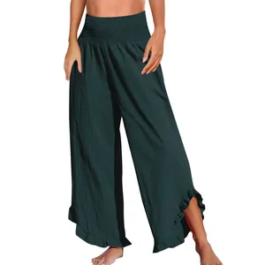 Detail einer Hose mit hohem Bund, gerüschtem, unregelmäßigem Saum in Waldgrün