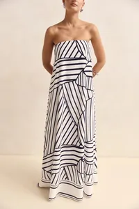 Detail view of a strapless maxi dress with a bold black and white geometric print