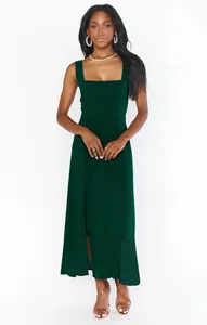 Front view of elegant dark green square neck midi dress featuring a stylish side slit