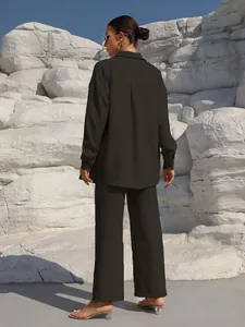 Back view of a black long-sleeve shirt and wide-leg trousers casual two-piece set