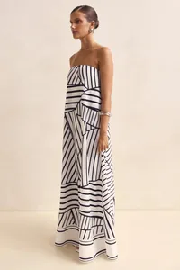 Detailed view of women's strapless maxi dress with black and white geometric print