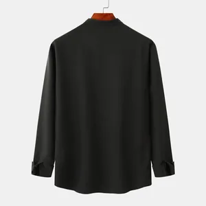 Back view of a black men's loose linen shirt with a stand collar and long sleeves.
