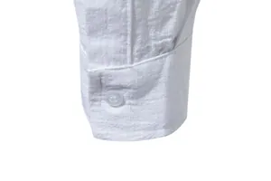Close-up of white cotton linen men shirt cuff showing button and fabric texture