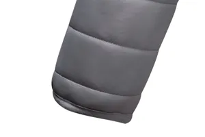Close-up view of grey quilted puffer jacket sleeve showing fine stitching and fabric detail