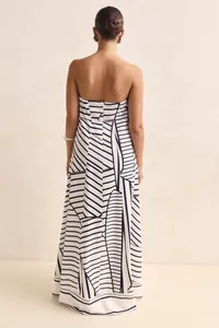 Elegant rear view of strapless maxi dress featuring black and white geometric print