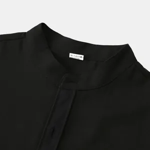Close-up of black men's shirt stand-up collar and cotton blend fabric texture