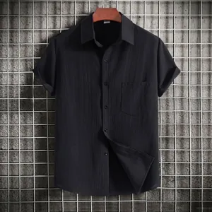 Classic black men's short sleeve casual shirt featuring a front pocket and lapel collar