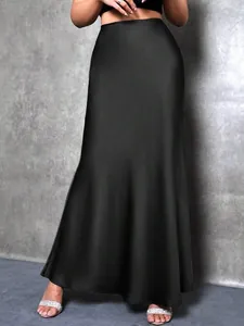 Detailed view of elegant black satin maxi skirt featuring a smooth silk-like fabric finish