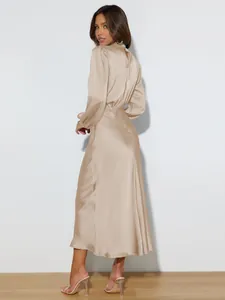 Elegant champagne satin long sleeve maxi dress featuring back cut-out detail view