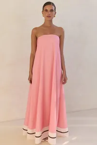 Elegant pink strapless maxi dress with contrast white hem stripe for chic summer parties