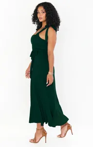 Side view of an elegant dark green sleeveless maxi dress with a waist tie detail