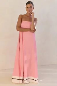 Elegant strapless pink maxi dress with contrast hem design for summer evening party look.