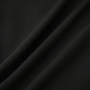 Detailed close-up showing the high-quality black linen fabric texture of a men's shirt