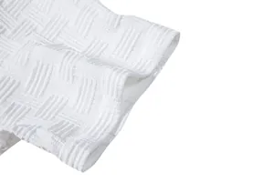 Detailed view of the intricate white jacquard texture on this ethnic style men's shirt