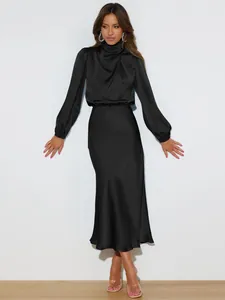 Elegant black satin long-sleeve dress featuring a mock neck and flowing midi skirt.