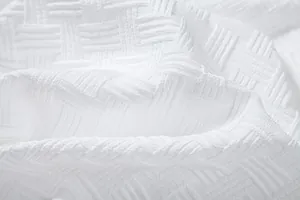 Close-up of white textured seersucker fabric for men's ethnic style summer shirt set