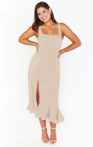 Elegant beige sleeveless midi dress with square neck, front slit, and ruffled hem.