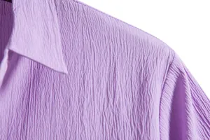 Close-up of men's summer short-sleeved shirt in purple textured seersucker fabric