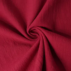 Detailed macro view of high-quality breathable red cotton linen fabric texture for summer
