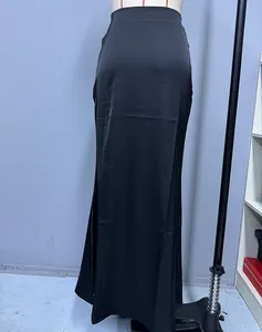 Elegant full length black satin maxi skirt on mannequin showing smooth fabric drape