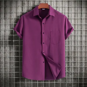 Close-up view of a magenta men's short-sleeve casual shirt with a textured fabric and pocket