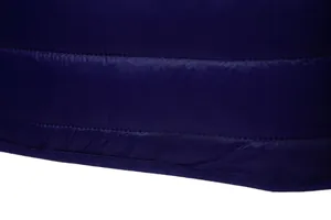 Macro detail of navy blue quilted puffer jacket showing high-quality stitching