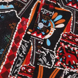Close-up view of vibrant ethnic pattern and button placket on a casual Hawaiian shirt