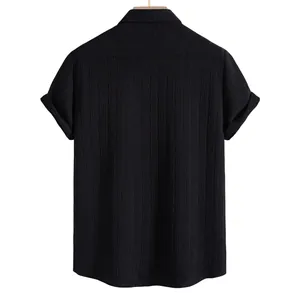 Back view of men's black short sleeve shirt with textured ethnic weave pattern