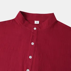 Close-up detail of burgundy men's cotton linen shirt with band collar and buttons