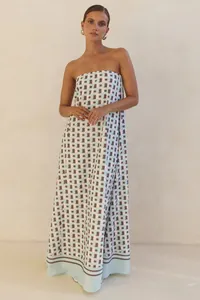 Full-length view of a strapless maxi dress with blue and brown geometric patterns.