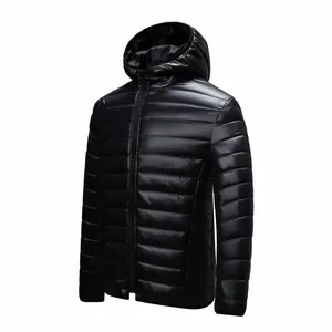 Detailed close-up of a lightweight black hooded puffer jacket with a shiny quilted finish