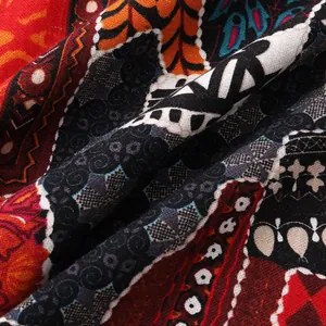 Detailed macro shot of men's Hawaiian shirt fabric with vibrant ethnic tribal patterns